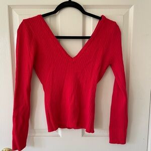 Large, long sleeve red shirt.